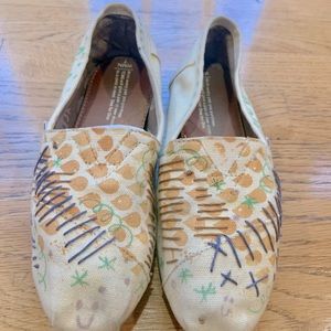 Cream colored TOMS casuals